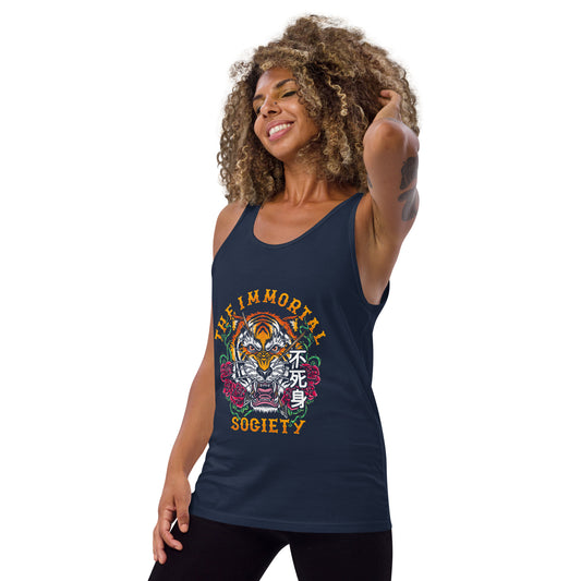 A tattooed women wearing a navy tank top with The Immortal Tiger design. She is standing in front of a white background.
