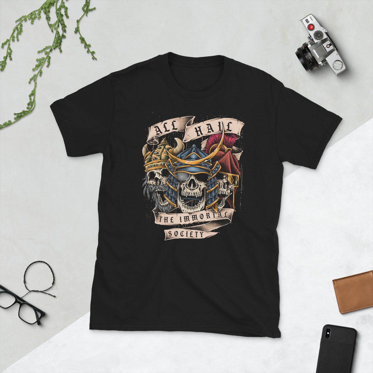 A black color t shirt on display with The Immortal Warriors design on it.