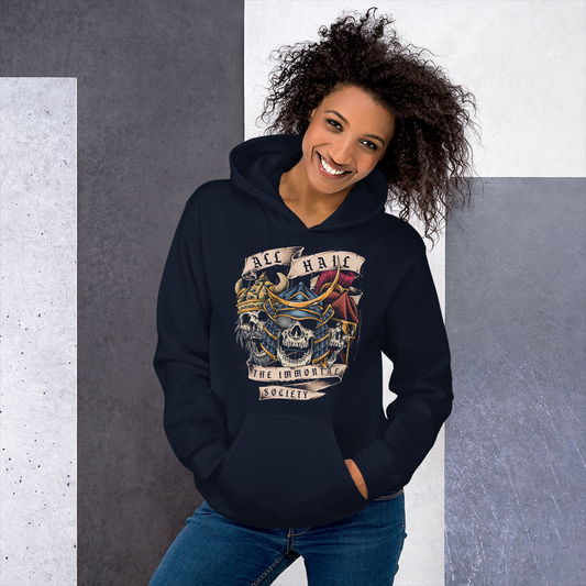 A young lady smiling wearing a navy hoodie with The Immortal Warriors design on it.
