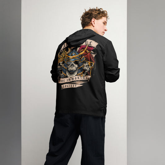 A man wearing a black jacket with The Immortal Society design on the back.