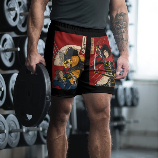 Up close view of a muscular man in the gym wearing black shorts with The Warrior's Tribute design on it by The Immortal Society. 