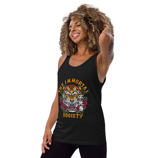A tattooed women wearing a black tank top with The Immortal Tiger design. She is standing in front of a white background.