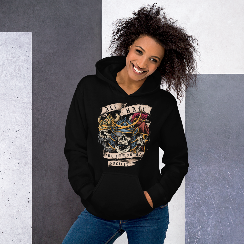 A young lady smiling wearing a black hoodie with The Immortal Warriors design on it.