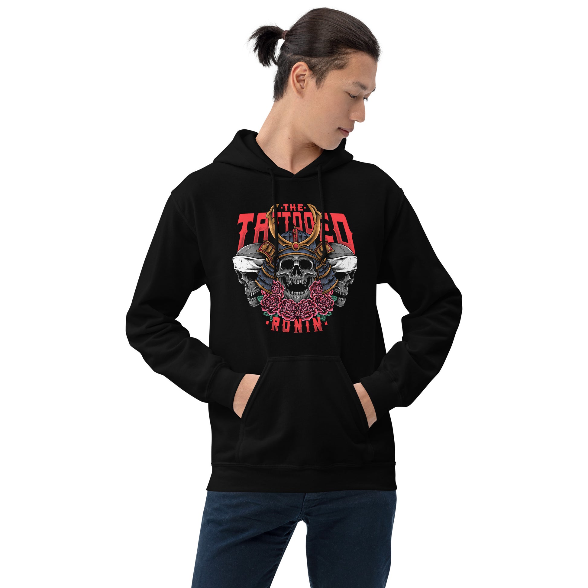 A Asian Man with a short pony tail wearing a black hoodie with The Tattooed Ronin design on it. He is standing in front of a white background. 