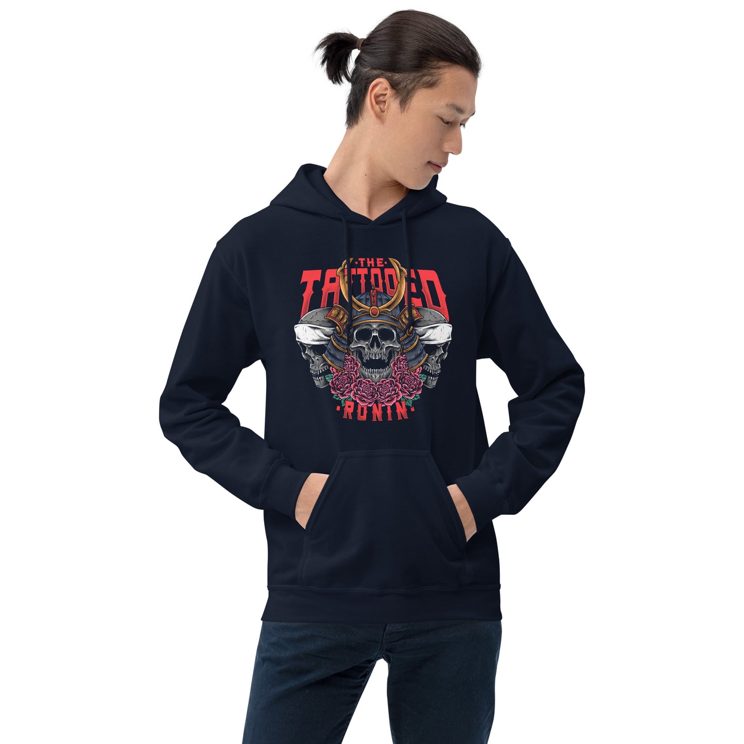 A Asian Man with a short pony tail wearing a navy hoodie with The Tattooed Ronin design on it. He is standing in front of a white background. 